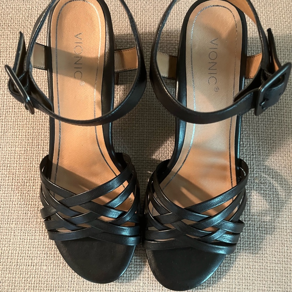 Vionic black sandals with 2” woven heel. Brand new. Comes in original box.